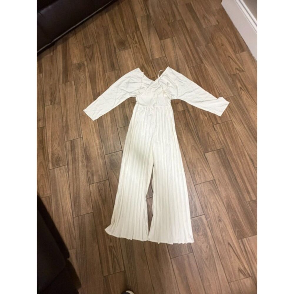 white pleated romper long sleeve small tie back